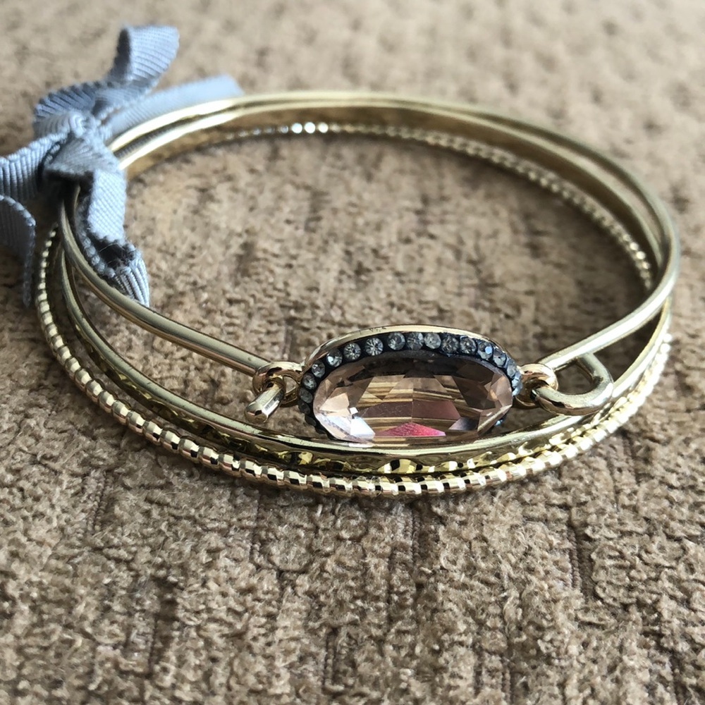 Set of 3- gold bangle bracelets.